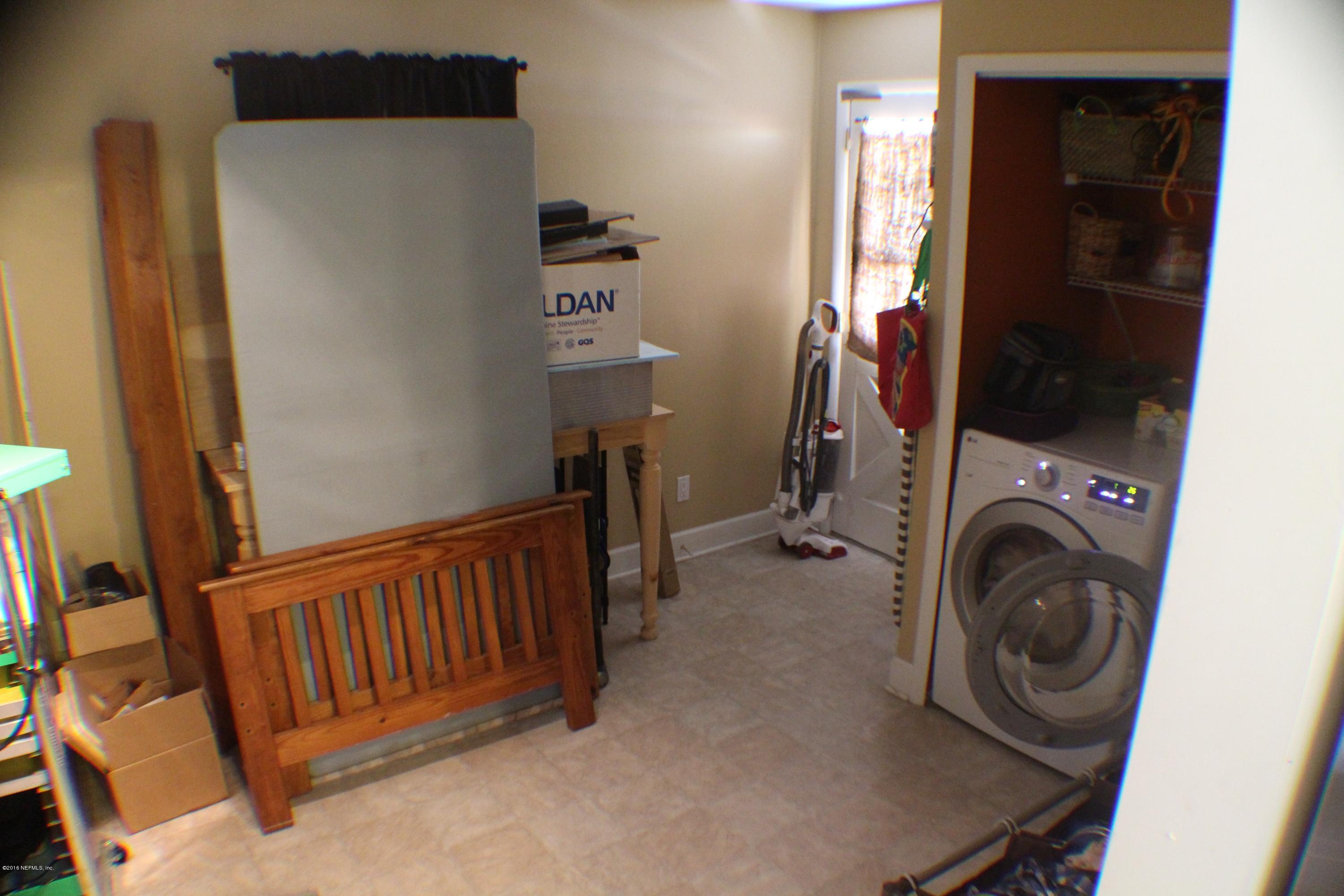 5871 Ridgeway Road East Jacksonville, FL 32244 - Photo 13 of 19 a view of a hallway with washer and dryer