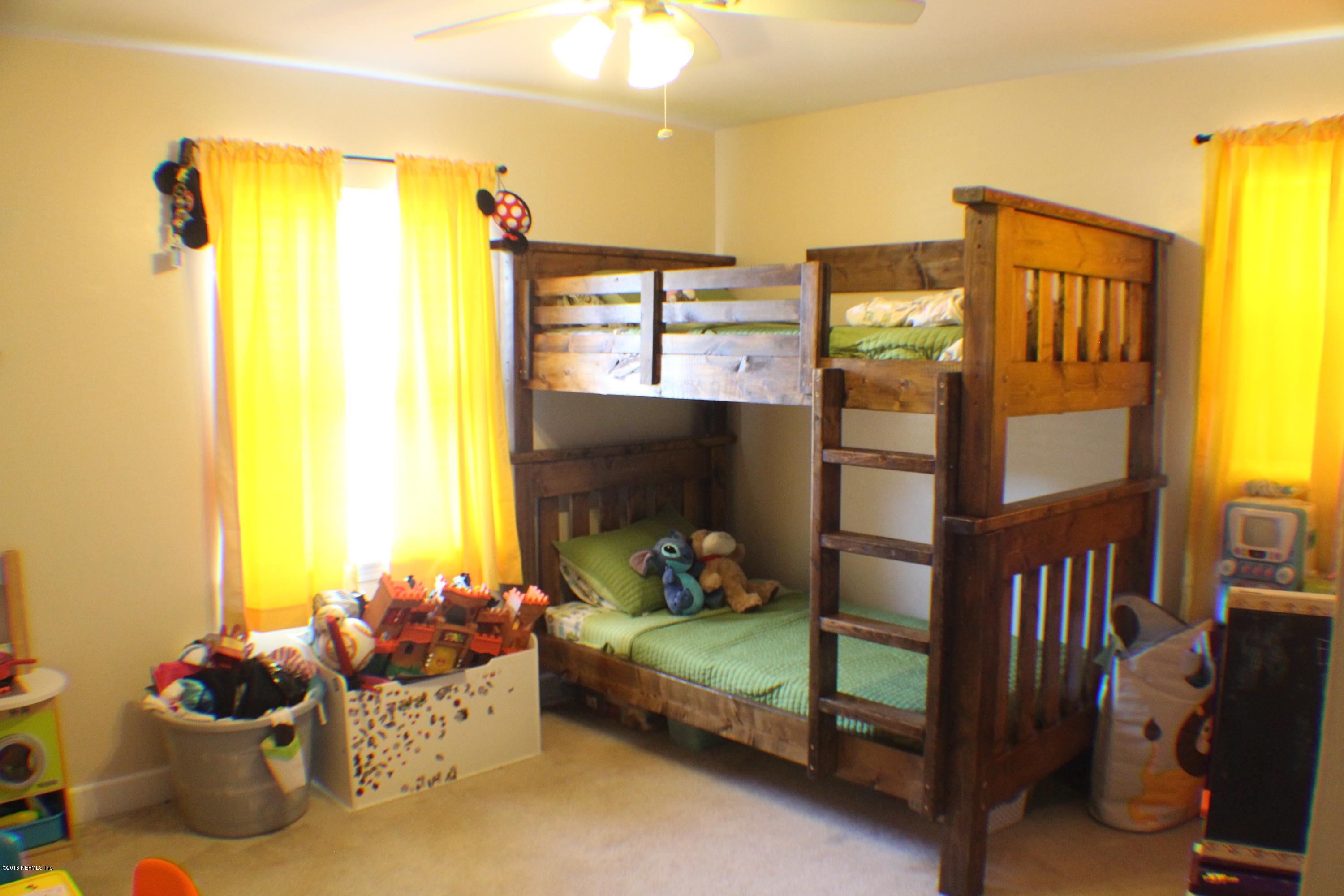 5871 Ridgeway Road East Jacksonville, FL 32244 - Photo 5 of 19 a bedroom with natural light