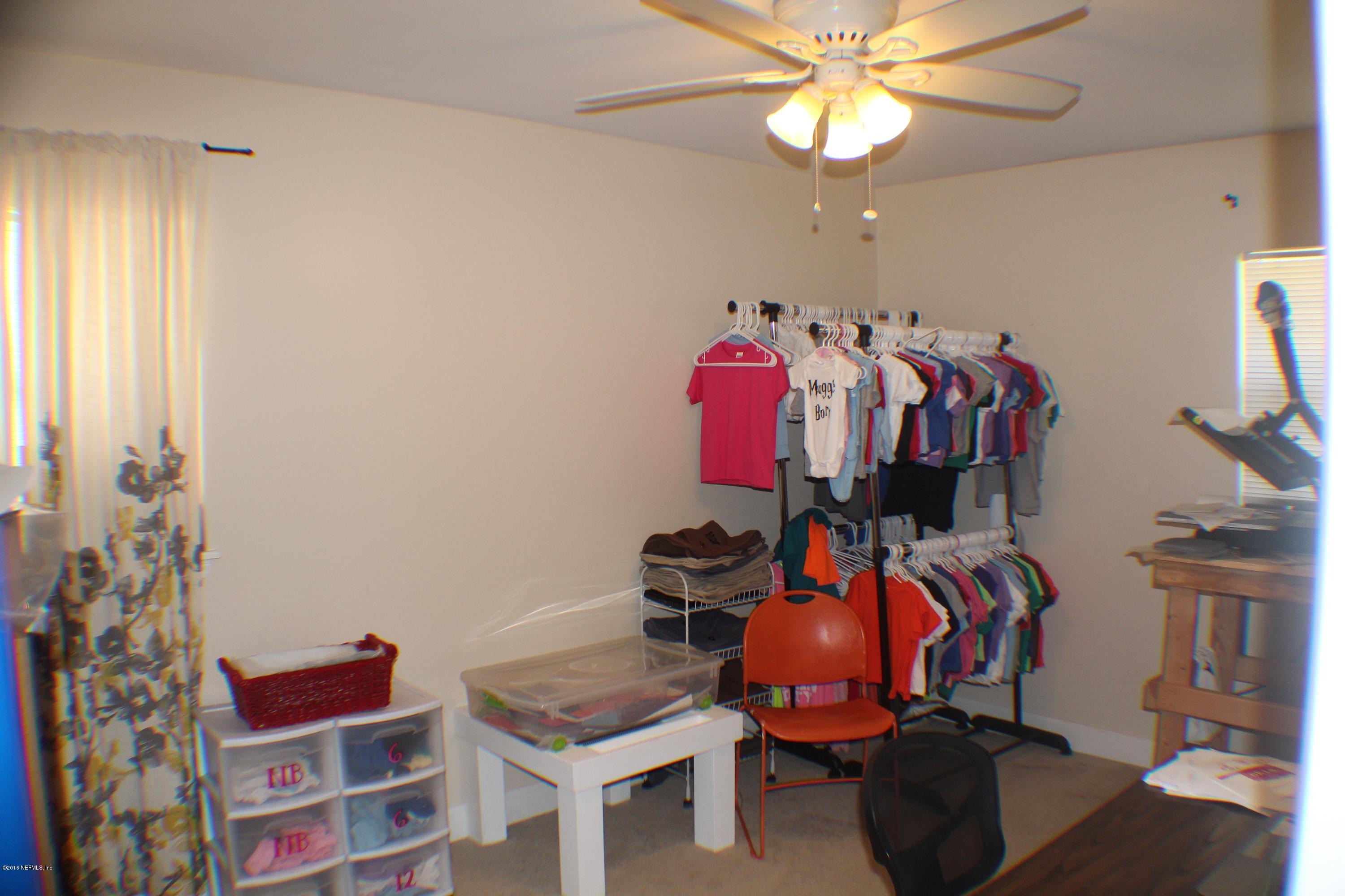 5871 Ridgeway Road East Jacksonville, FL 32244 - Photo 6 of 19 a view of a room with gym equipment