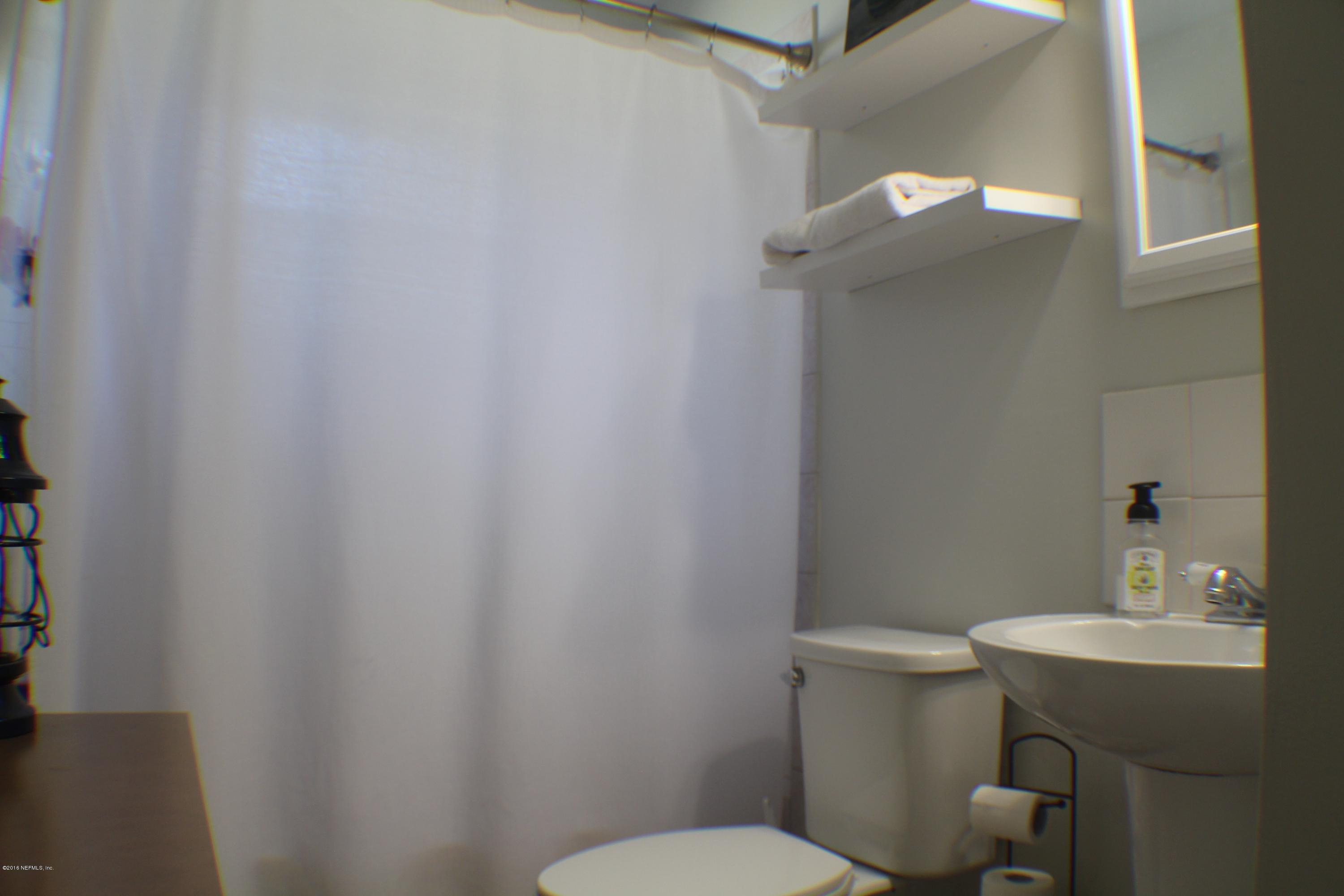 5871 Ridgeway Road East Jacksonville, FL 32244 - Photo 8 of 19 a bathroom with a sink mirror and toilet