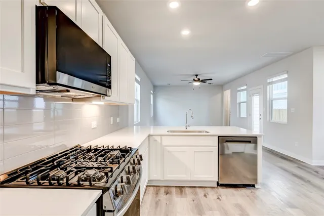 a kitchen with a stove and a microwave