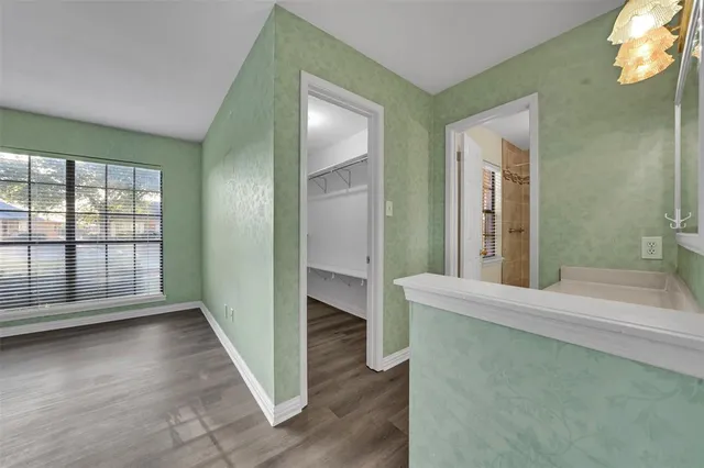 wooden floor with a window in a room