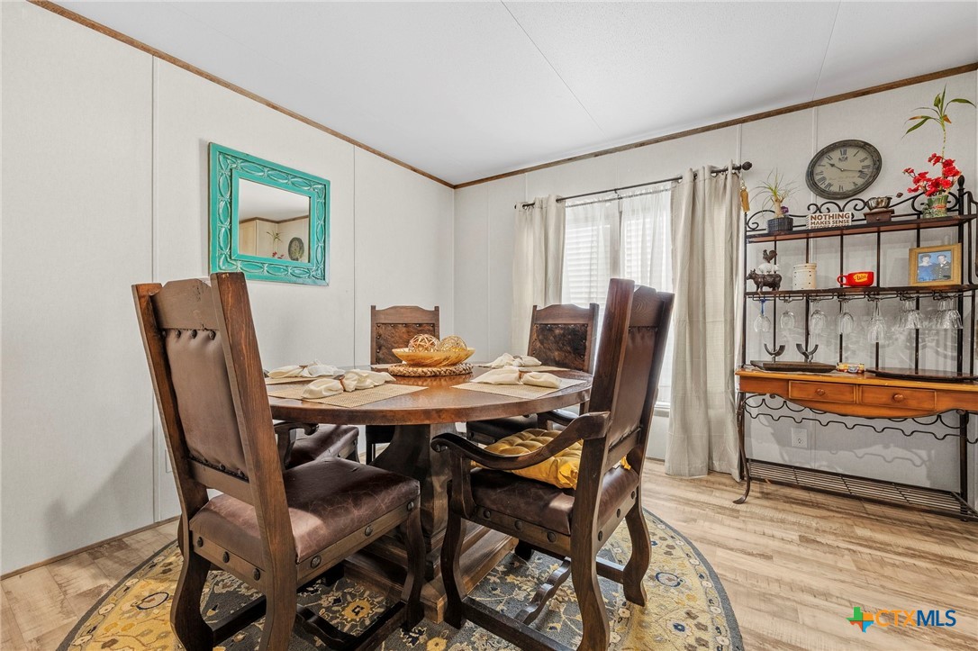 300 Private Road 3221 Kempner, TX 76539 - Photo 13 of 32 a view of a dining room with furniture a rug and wooden floor