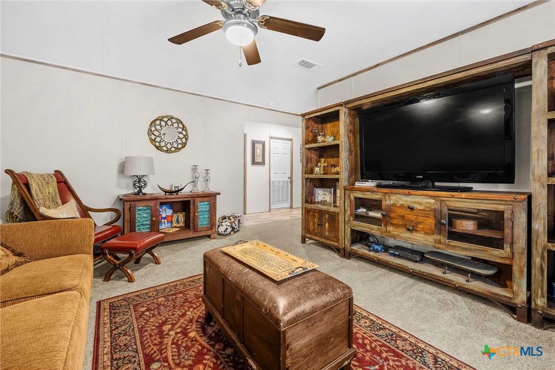300 Private Road 3221 Kempner, TX 76539 - Photo 16 of 32 a living room with furniture and a flat screen tv