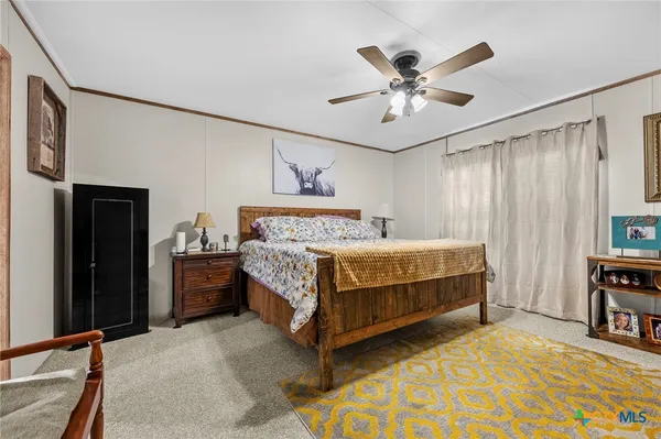 a bathroom with a granite countertop sink and a toilet