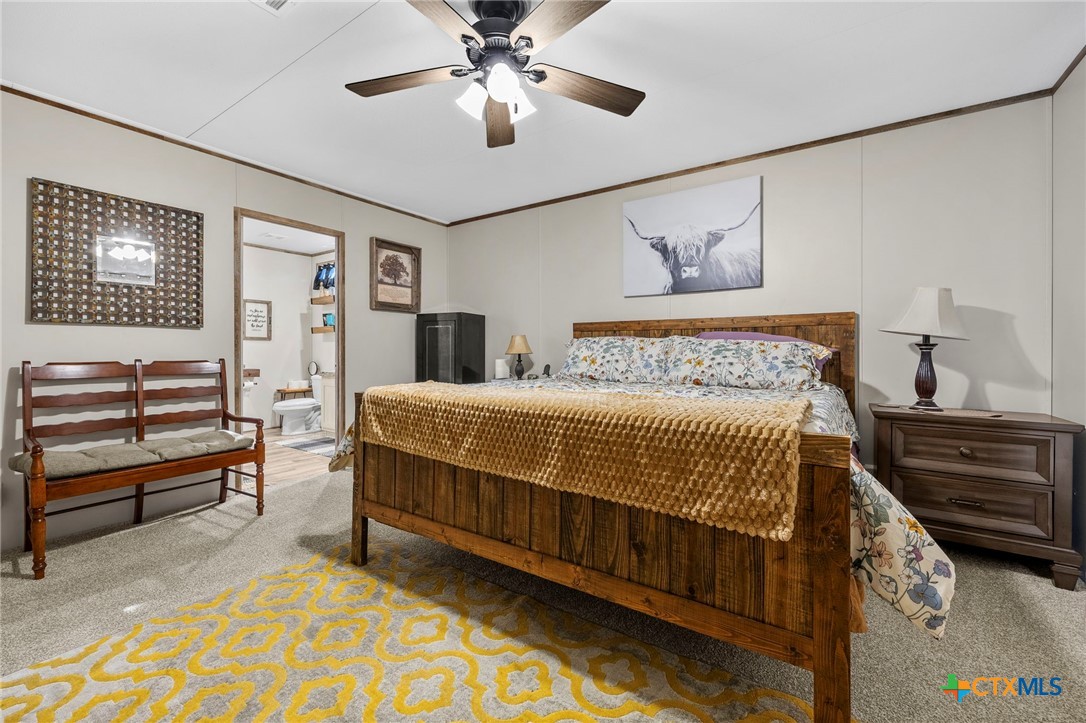 300 Private Road 3221 Kempner, TX 76539 - Photo 21 of 32 a bedroom with bed and wooden floor