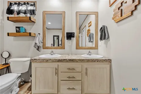 a bathroom with a shower and a glass door