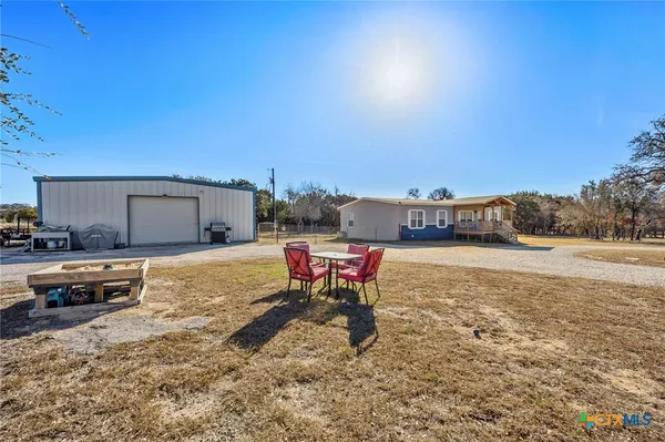 a view of a house with a snow in the background