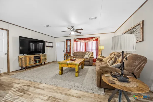 a kitchen with refrigerator and window