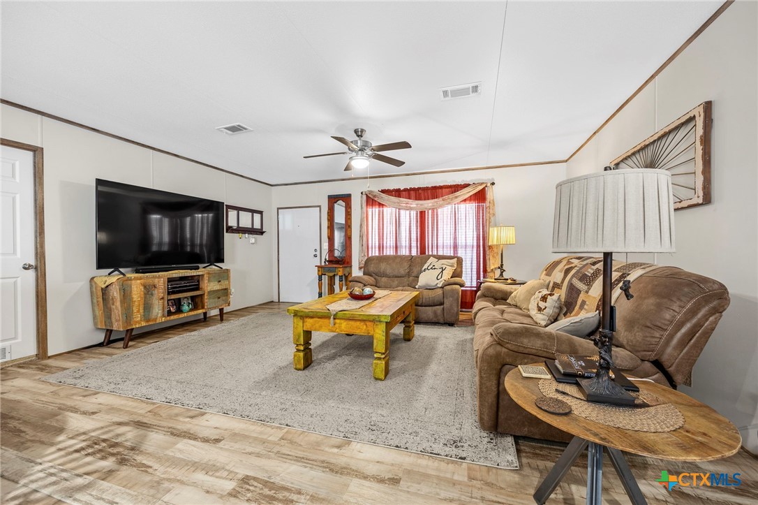 300 Private Road 3221 Kempner, TX 76539 - Photo 7 of 32 a living room with furniture and a flat screen tv