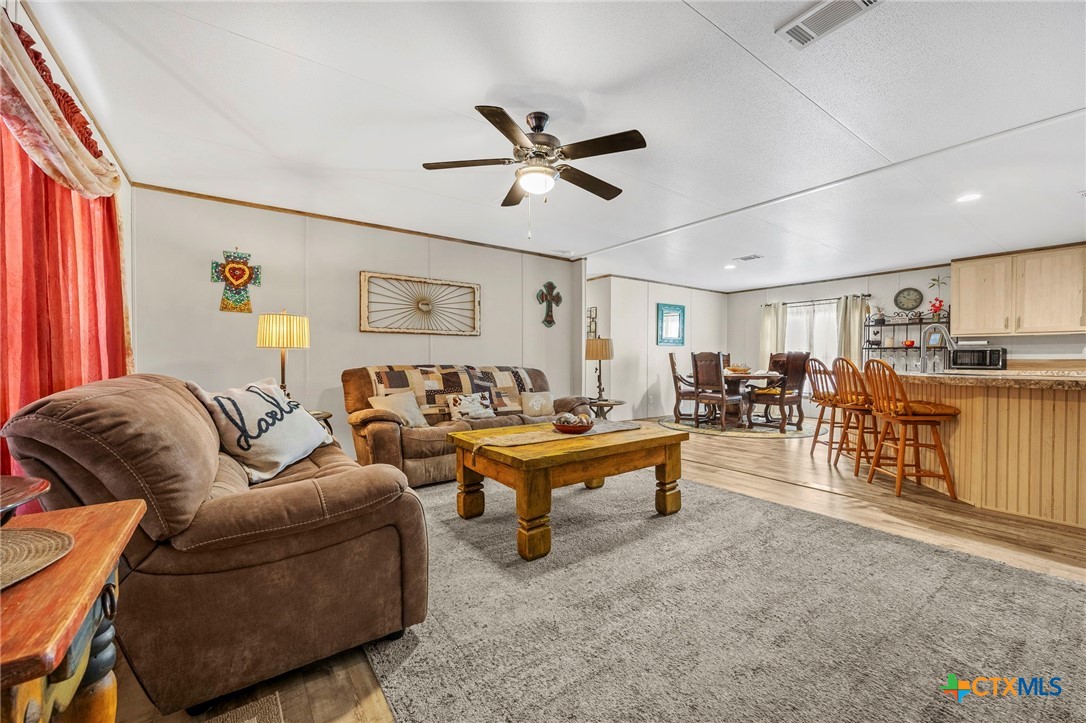 300 Private Road 3221 Kempner, TX 76539 - Photo 8 of 32 a living room with furniture and a ceiling fan