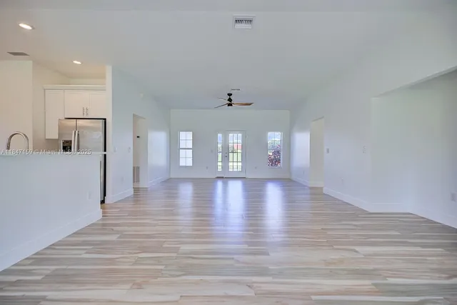 a view of a room with window and wooden floor