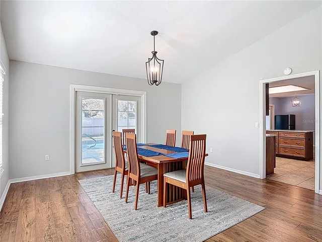 a living room with furniture a rug and a chandelier