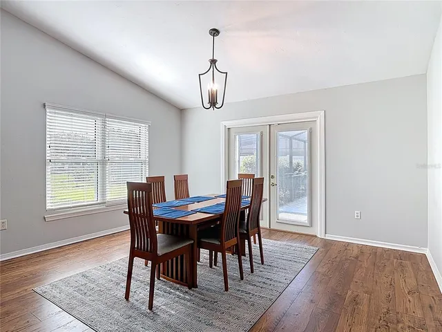 a view of an empty room with a kitchen