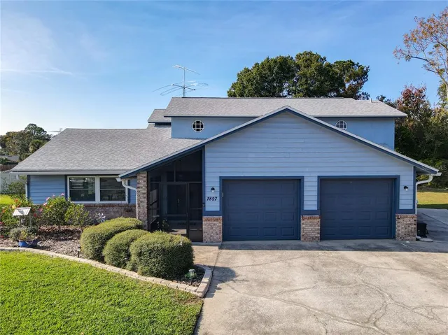 a view of front of house with a yard