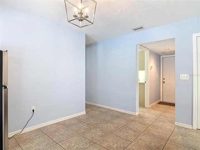 a bedroom with a bed and a television