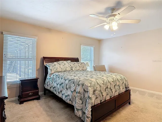 a bedroom with a bed and a television