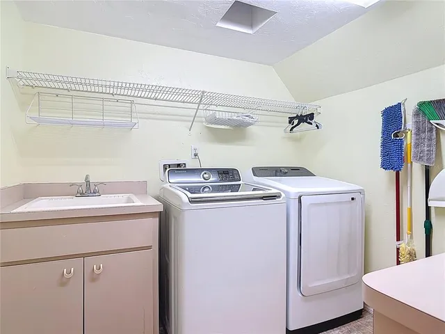 an empty room with a window and ceiling fan