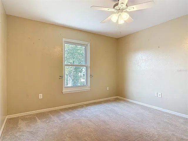 a view of a kitchen with a sink and dishwasher a dining table with garden view