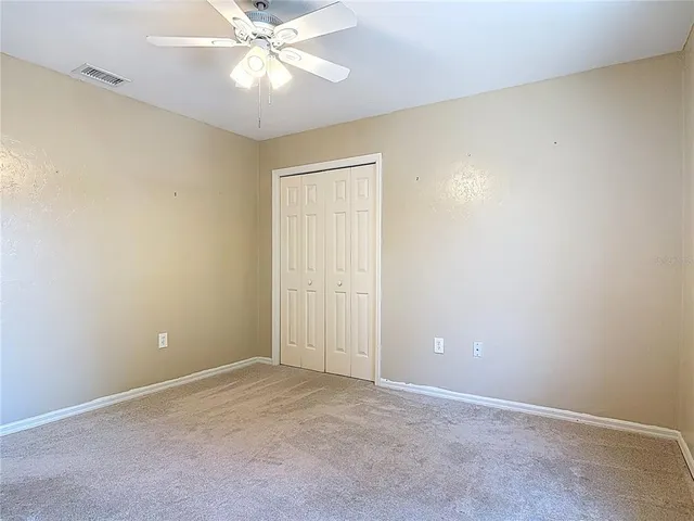 a view of a swimming pool with a yard