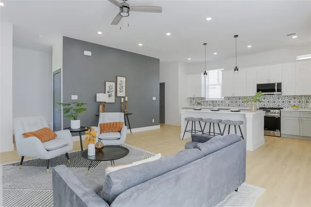 a living room with furniture and a fireplace