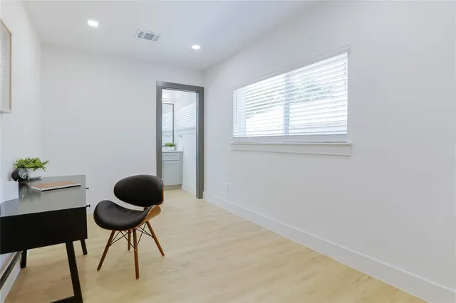 a workspace with furniture and a window