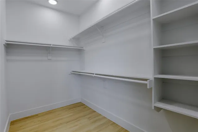 a view of a room with shelf on the wall