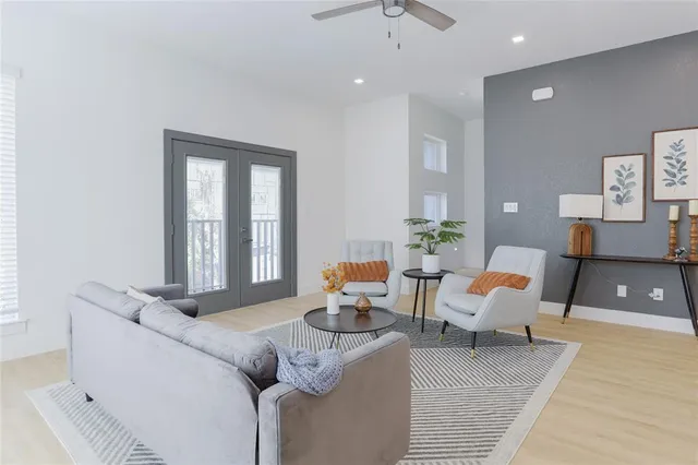 a living room with furniture and a window