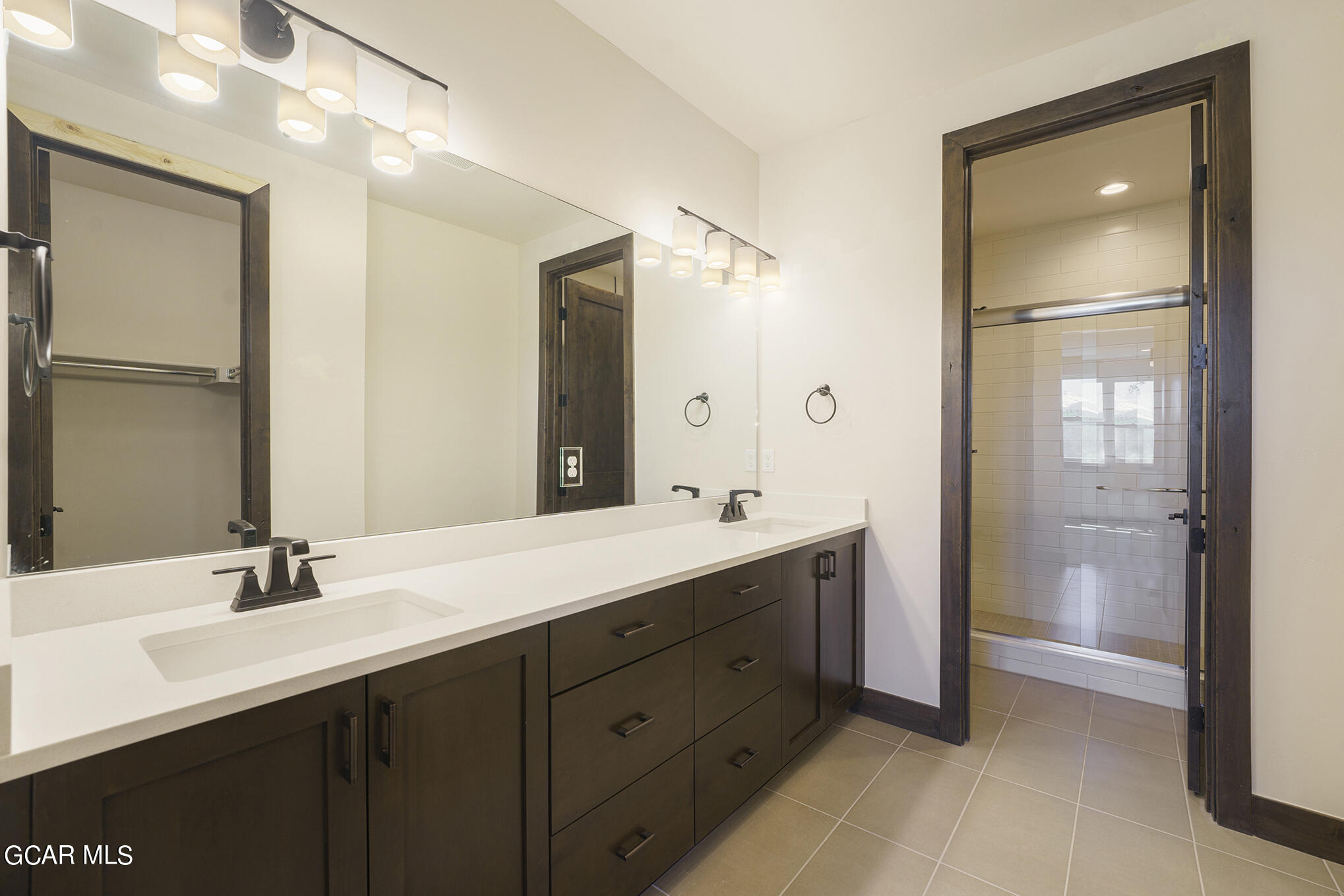 145 Homestead Loop Fraser, CO 80442 - Photo 12 of 22 a bathroom with a double vanity sink mirror and double