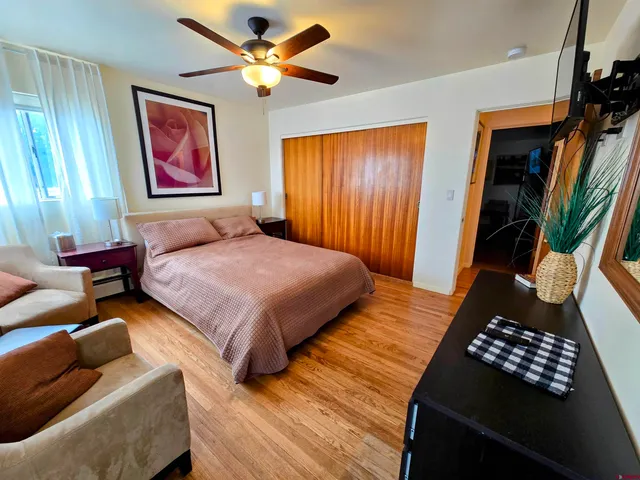 a bedroom with a bed furniture and a window