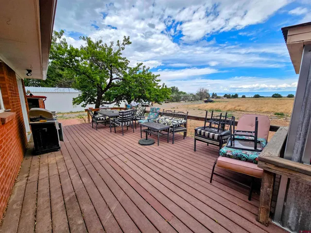a view of a terrace with seating area