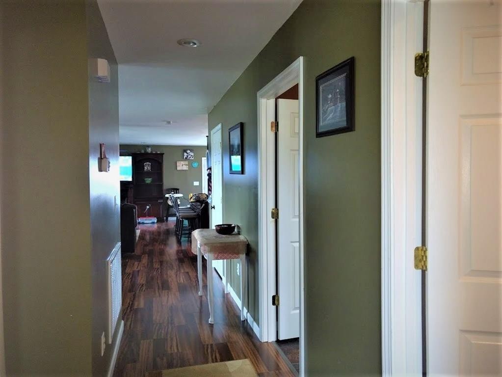 310 Highway 305 Decatur, TN 37322 - Photo 13 of 31 a view of a hallway with wooden floor fireplace and living room