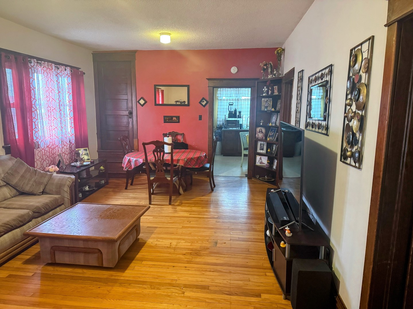 506 South Beech Street Arthur, IL 61911 - Photo 2 of 7 a living room with furniture rug and wooden floor