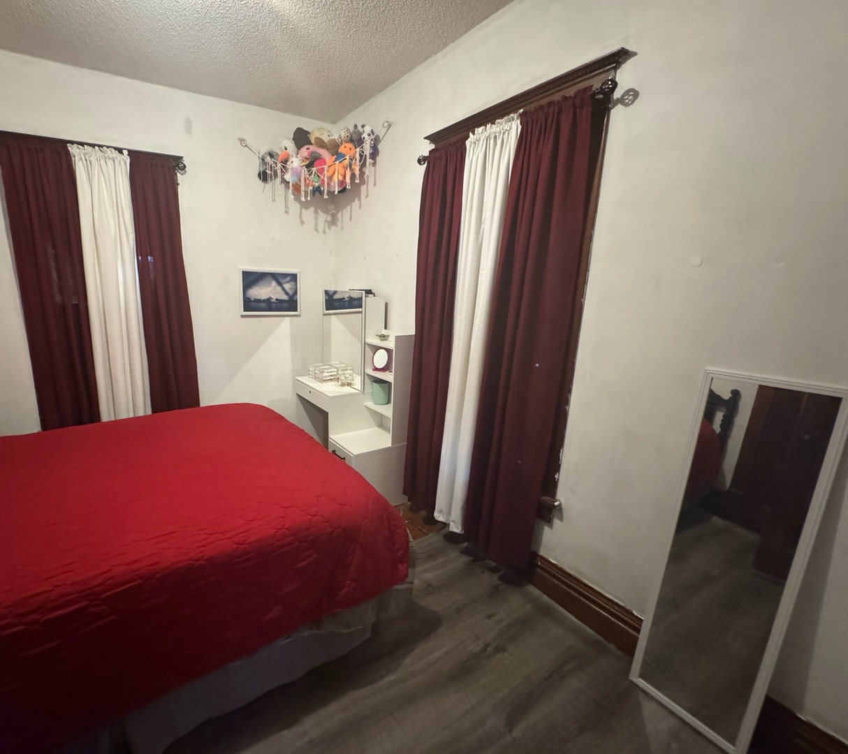 506 South Beech Street Arthur, IL 61911 - Photo 4 of 7 a bedroom with a bed and a mirror