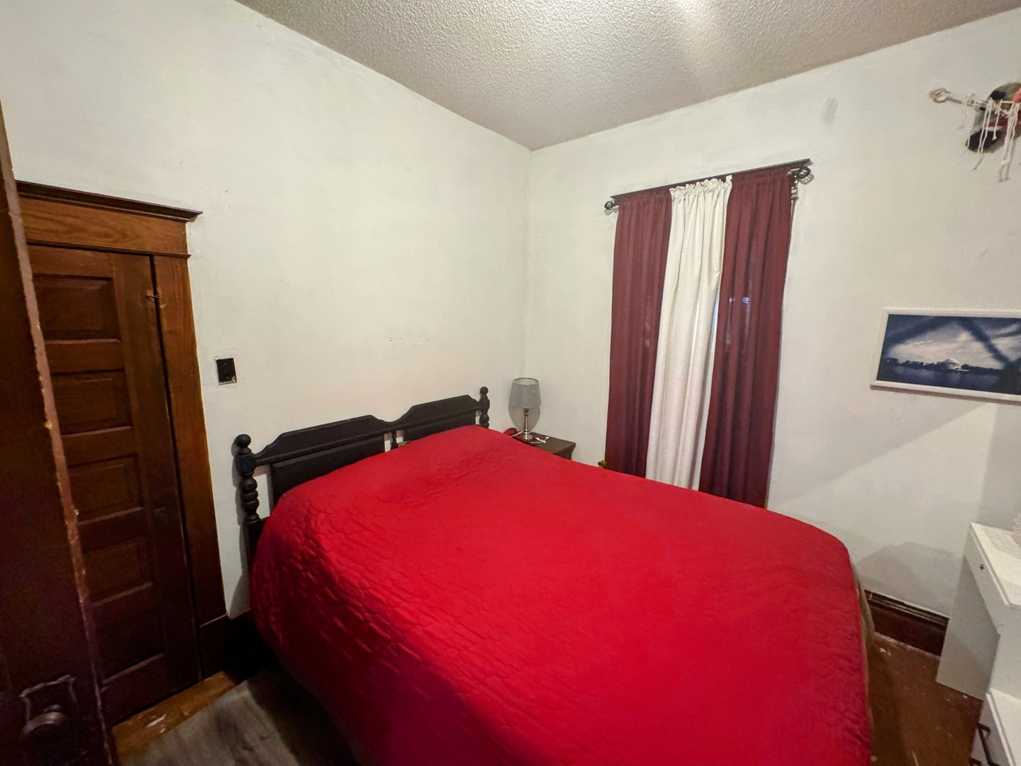 506 South Beech Street Arthur, IL 61911 - Photo 5 of 7 a blue bed sitting in a bedroom next to a window