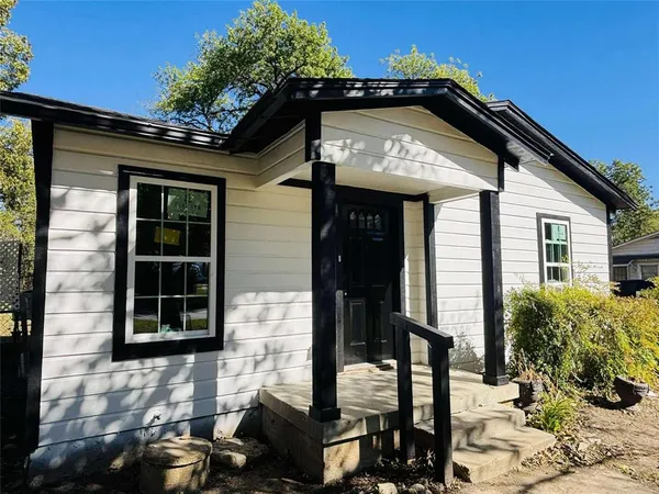 a front view of a house with parking