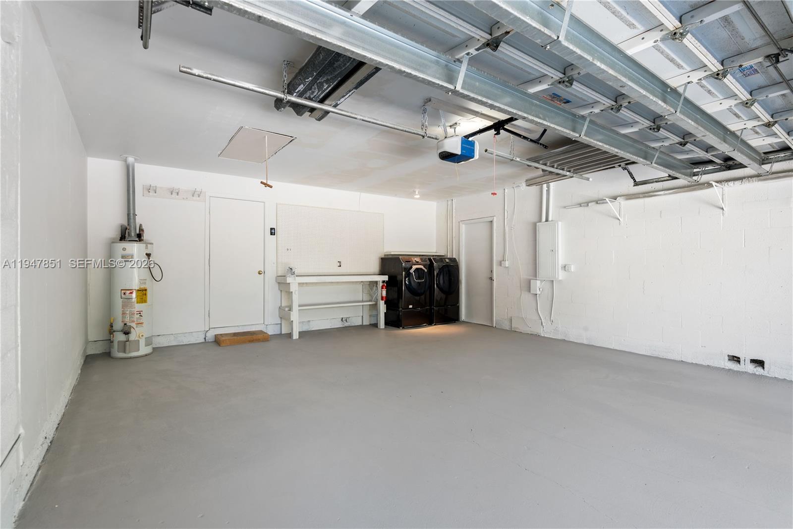 8420 Southwest 179th Street Palmetto Bay, FL 33157 - Photo 22 of 27 a view of a utility room with lots of storage