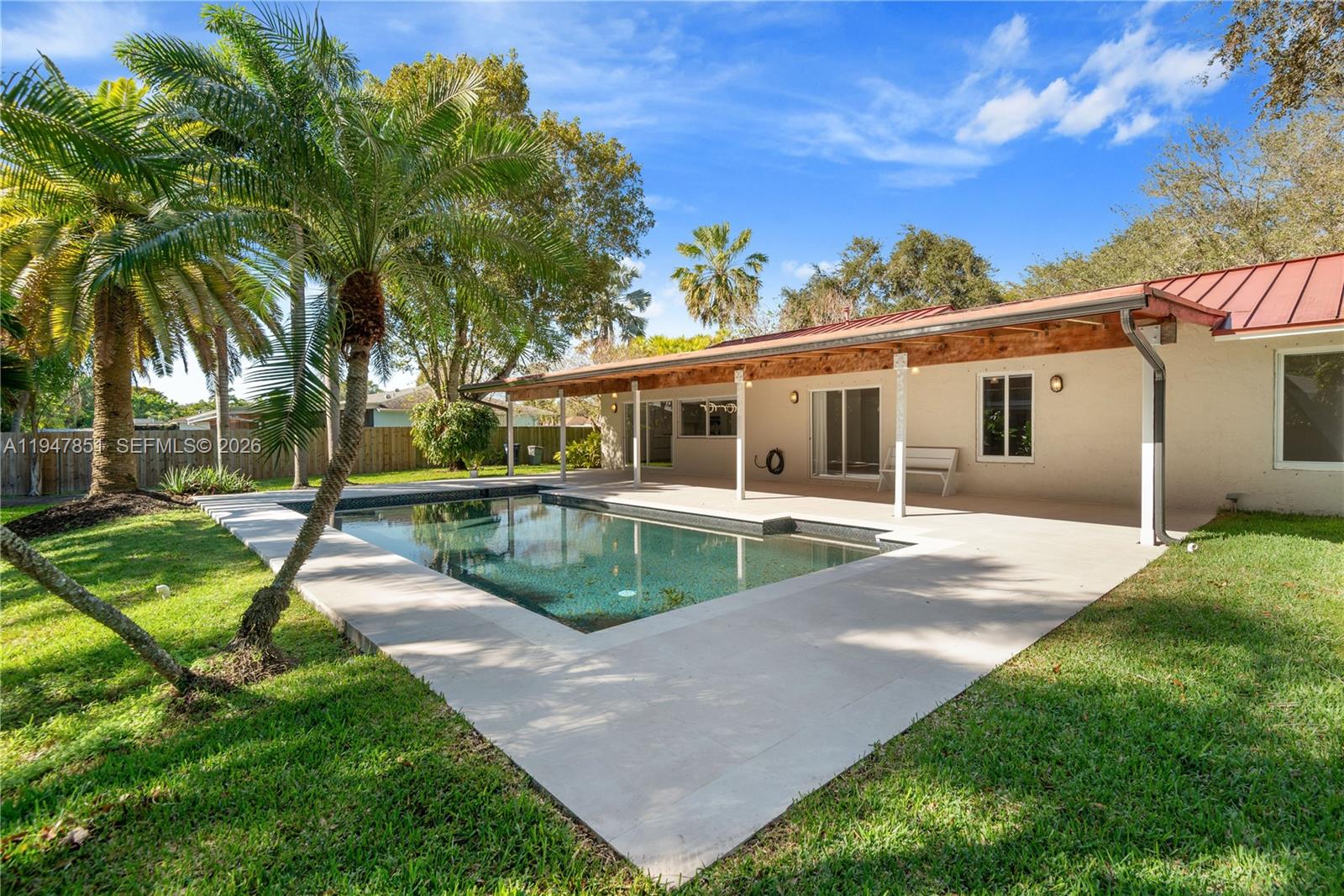 8420 Southwest 179th Street Palmetto Bay, FL 33157 - Photo 26 of 27 a view of a house with backyard