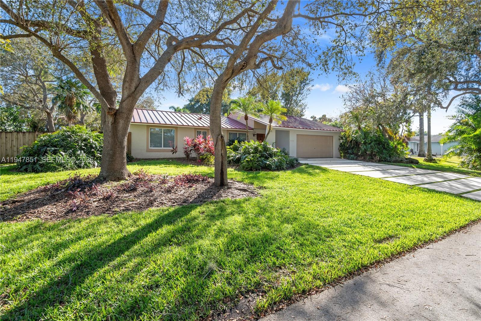 8420 Southwest 179th Street Palmetto Bay, FL 33157 - Photo 27 of 27 a front view of a house with garden