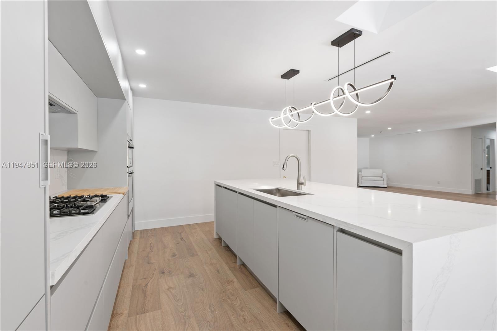 8420 Southwest 179th Street Palmetto Bay, FL 33157 - Photo 8 of 27 a kitchen with sink a stove and cabinets