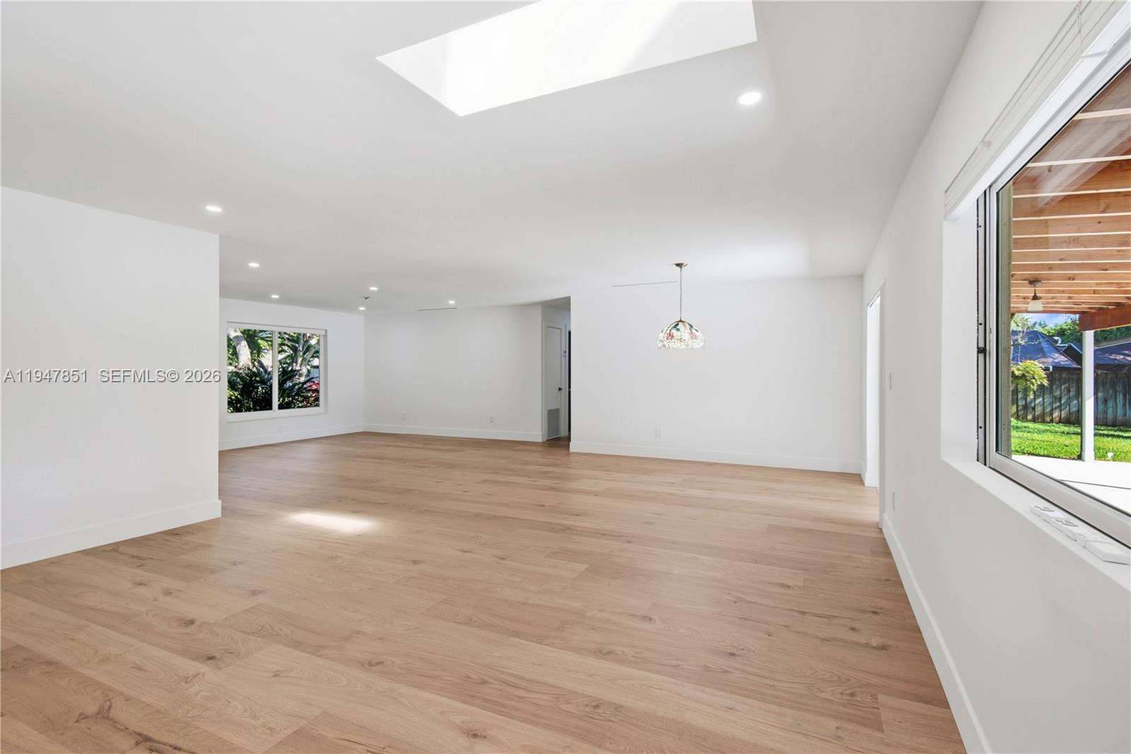 8420 Southwest 179th Street Palmetto Bay, FL 33157 - Photo 10 of 27 an empty room with windows and entrance