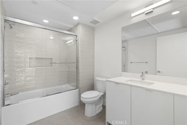 a bathroom with a sink a toilet and a bathtub