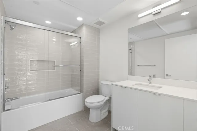 a bathroom with a sink a toilet and a bathtub