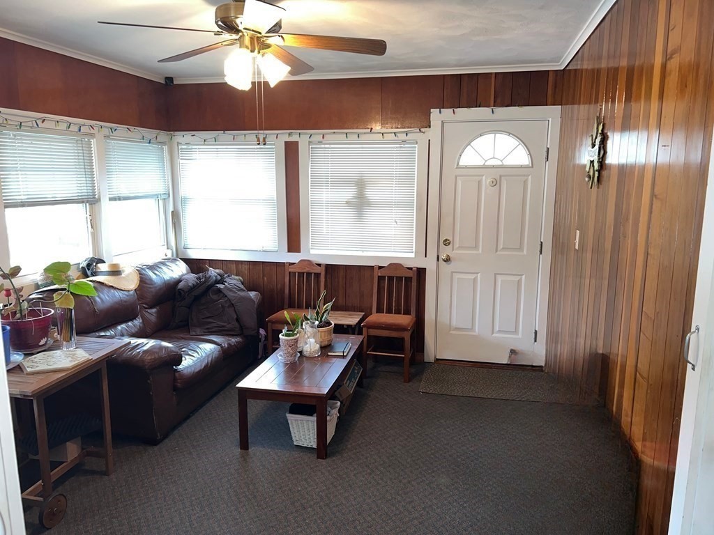 39 Mill Road Chelmsford, MA 01824 - Photo 11 of 22 a living room with furniture and a large window