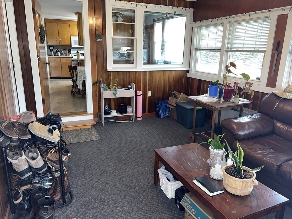 39 Mill Road Chelmsford, MA 01824 - Photo 12 of 22 a living room with furniture and a potted plant
