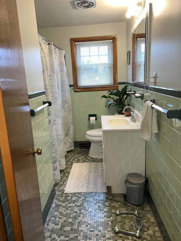 39 Mill Road Chelmsford, MA 01824 - Photo 8 of 22 a bathroom with a sink and toilet