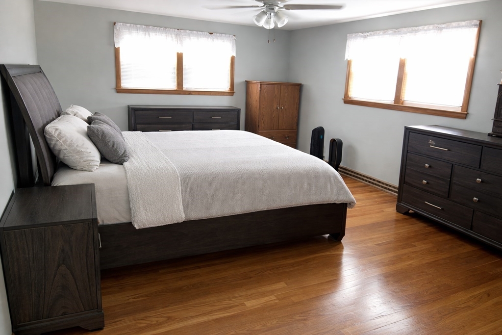 39 Mill Road Chelmsford, MA 01824 - Photo 9 of 22 a bedroom with a bed and a window