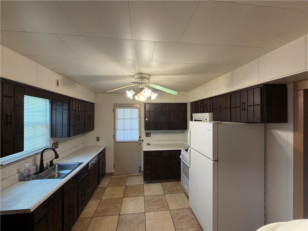 1041 4th Street Monongahela, PA 15063 - Photo 9 of 28 a kitchen with a refrigerator a sink and dishwasher