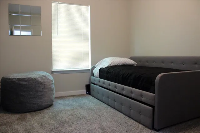 a living room with a couch and a window
