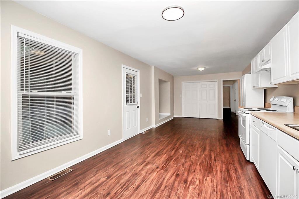 307 Harris Street Fort Mill, SC 29715 - Photo 14 of 39 a view of a kitchen with wooden floor and a window